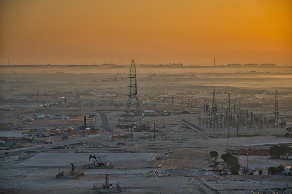 Oil field with pumpjacks at sunrise