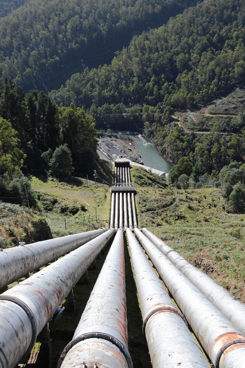 Pipelines running across a green hillside